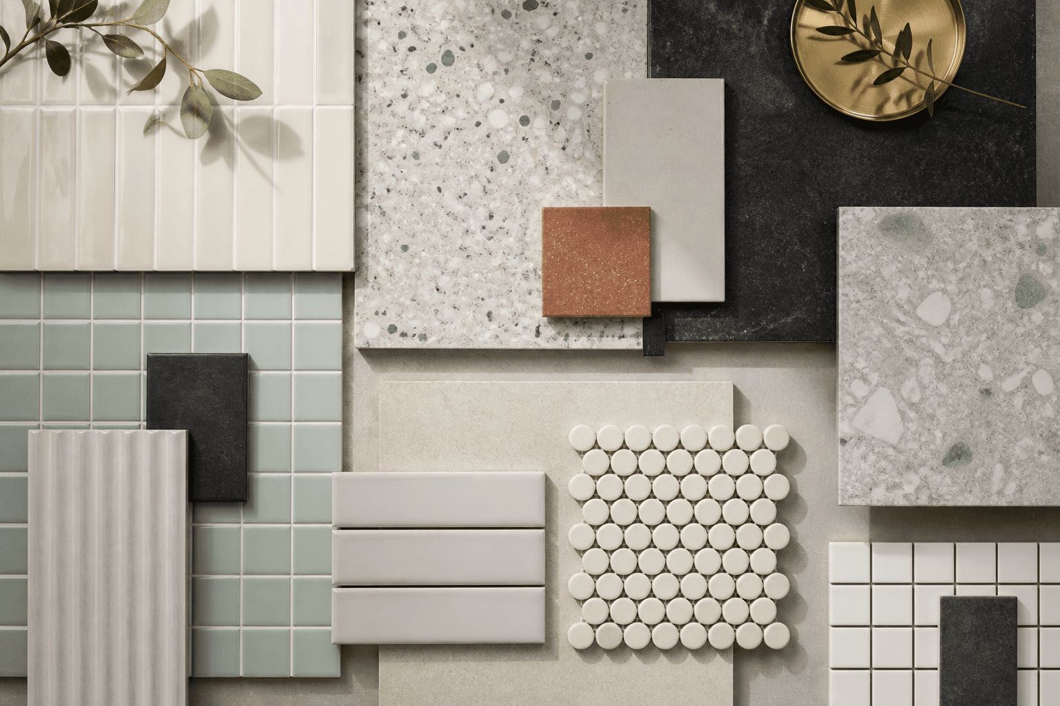 Ceramic, porcelain, terrazzo and mosaic tile samples arranged in a refined material board