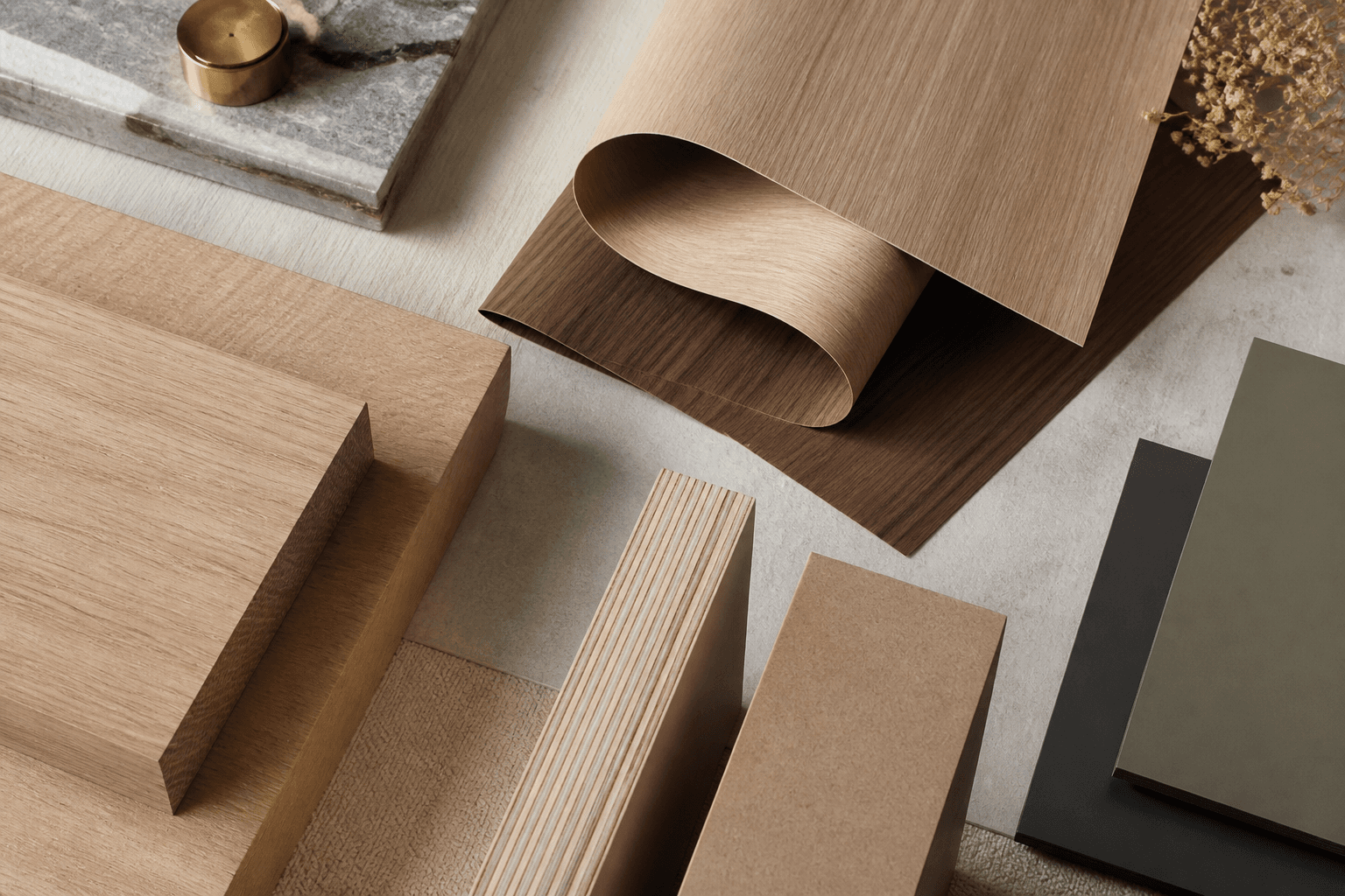 Solid wood, veneer sheets, plywood edge grain, MDF and laminate samples arranged together